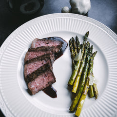 Sous Vide Cabernet Roasted Garlic Strip Steak with Pan Sauce